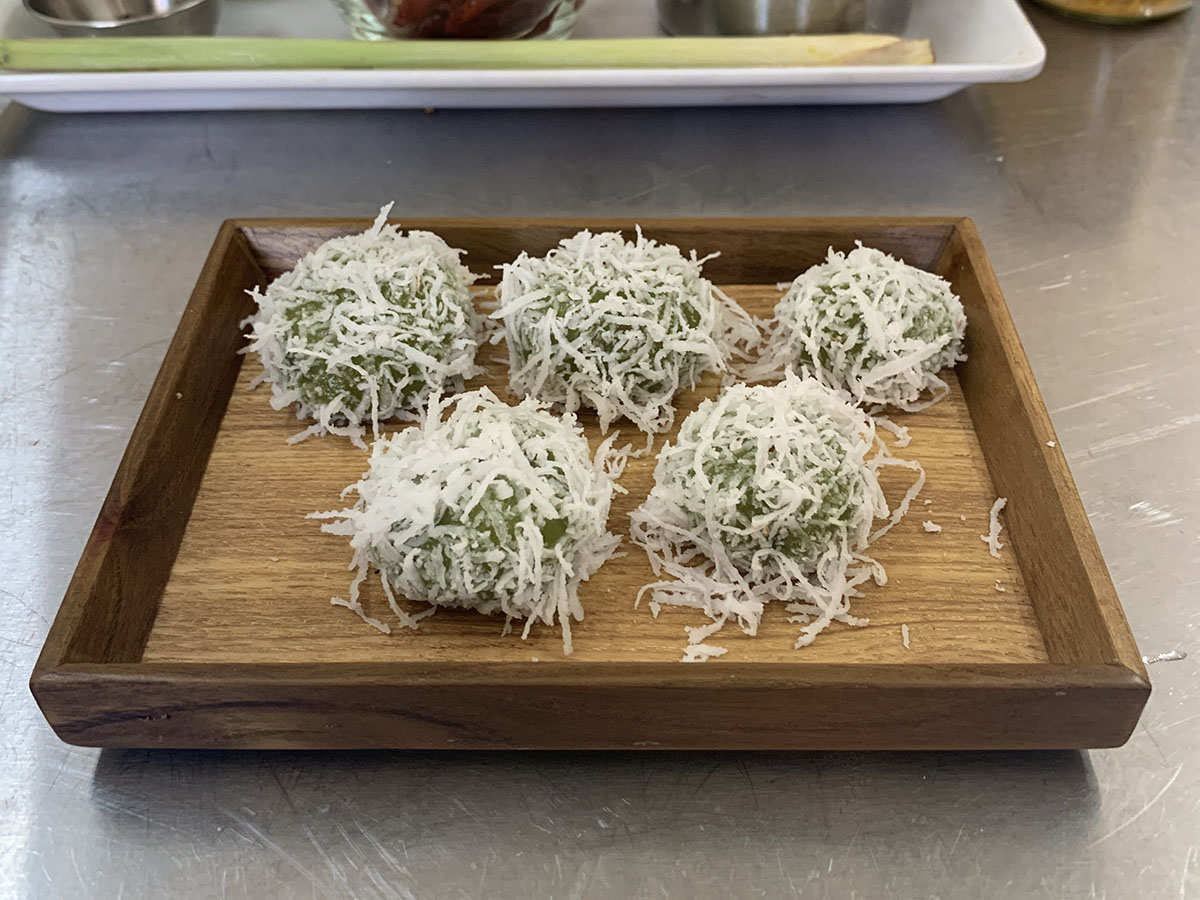 Ondeh-ondeh, a chewy ball with palm sugar & coconut flakes